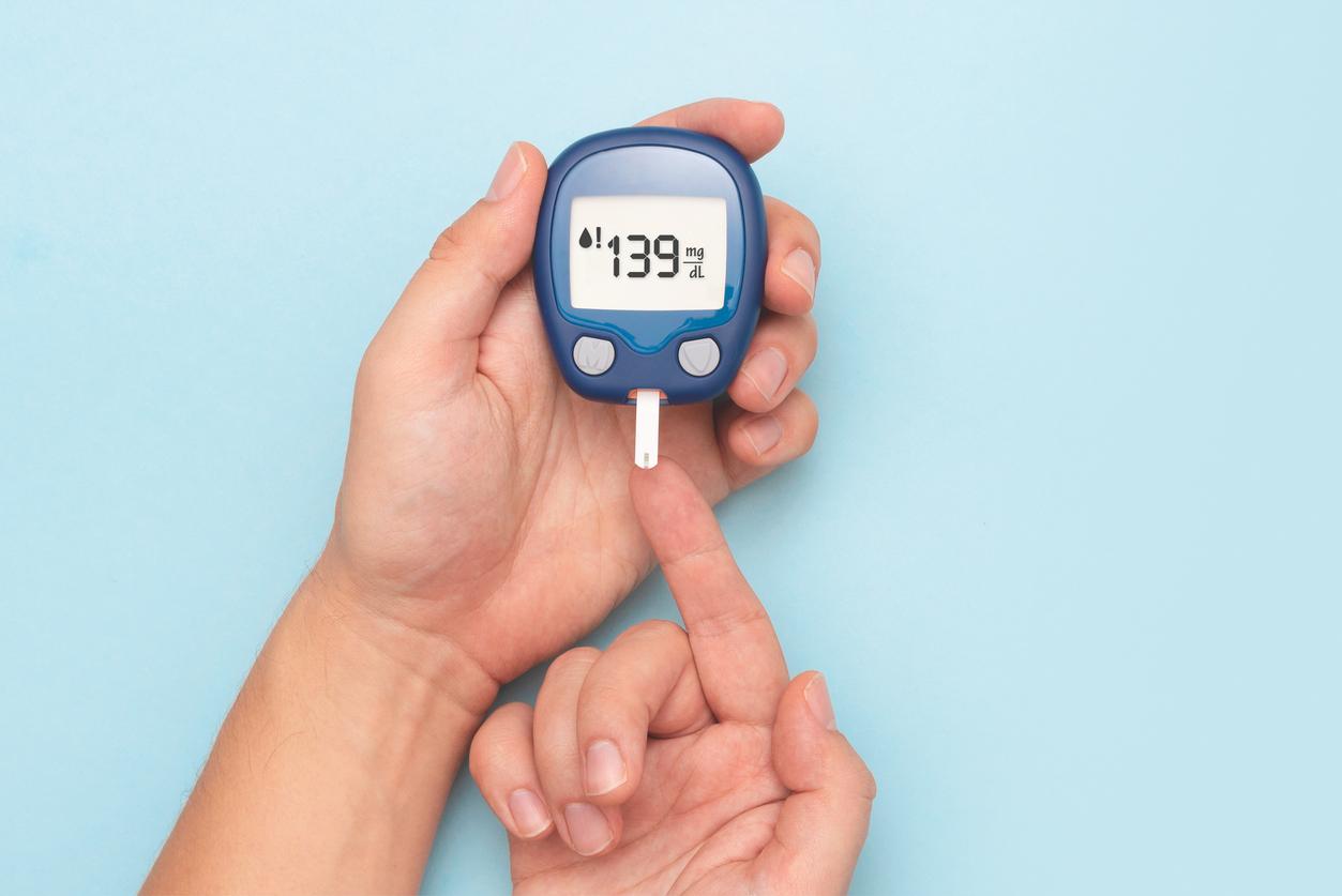 Man using glucometer, blood glucose test. Diabetes concept
